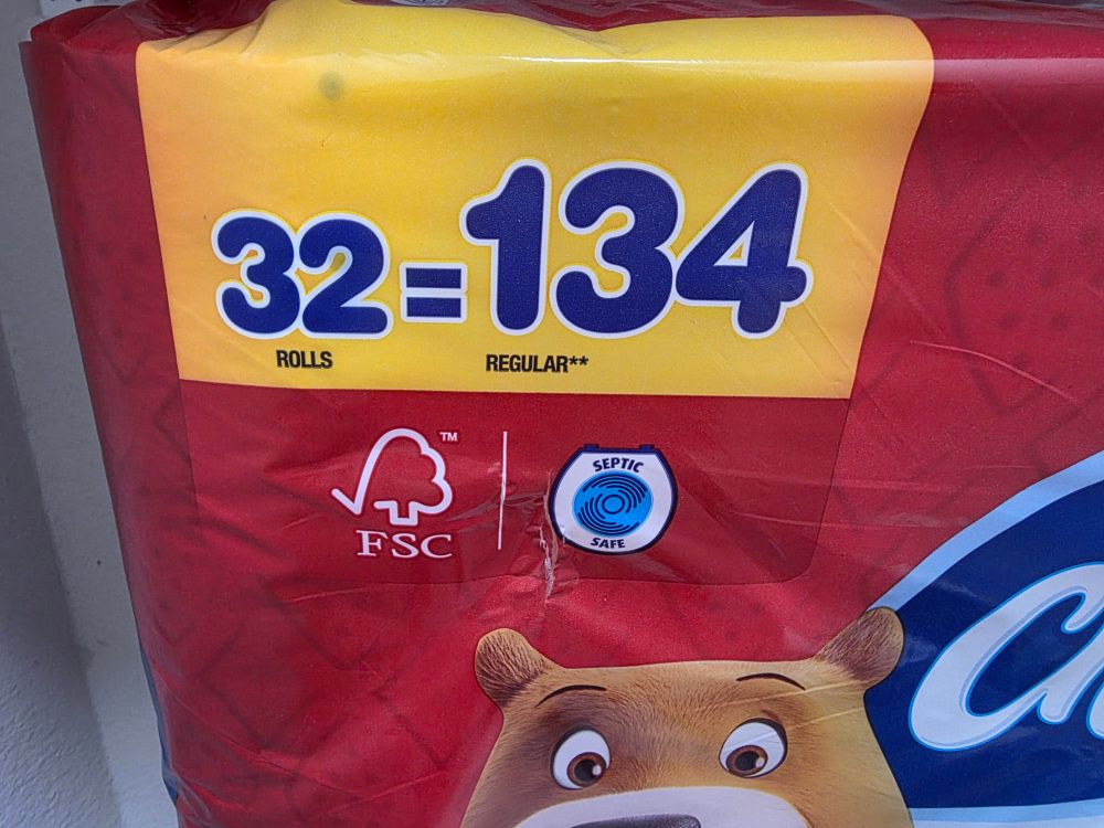 Toilet paper packaging, showing ridiculous mathematical acrobatics, claiming that 32 rolls equals 134 rolls of clearly imaginary "regular rolls."