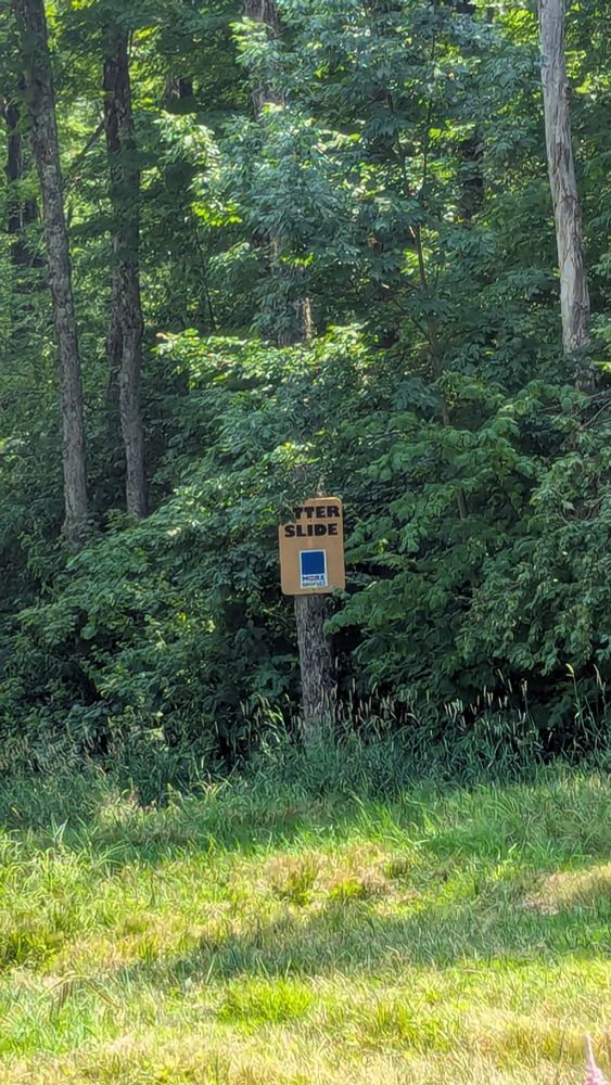 A sign that reads "otter slide" 