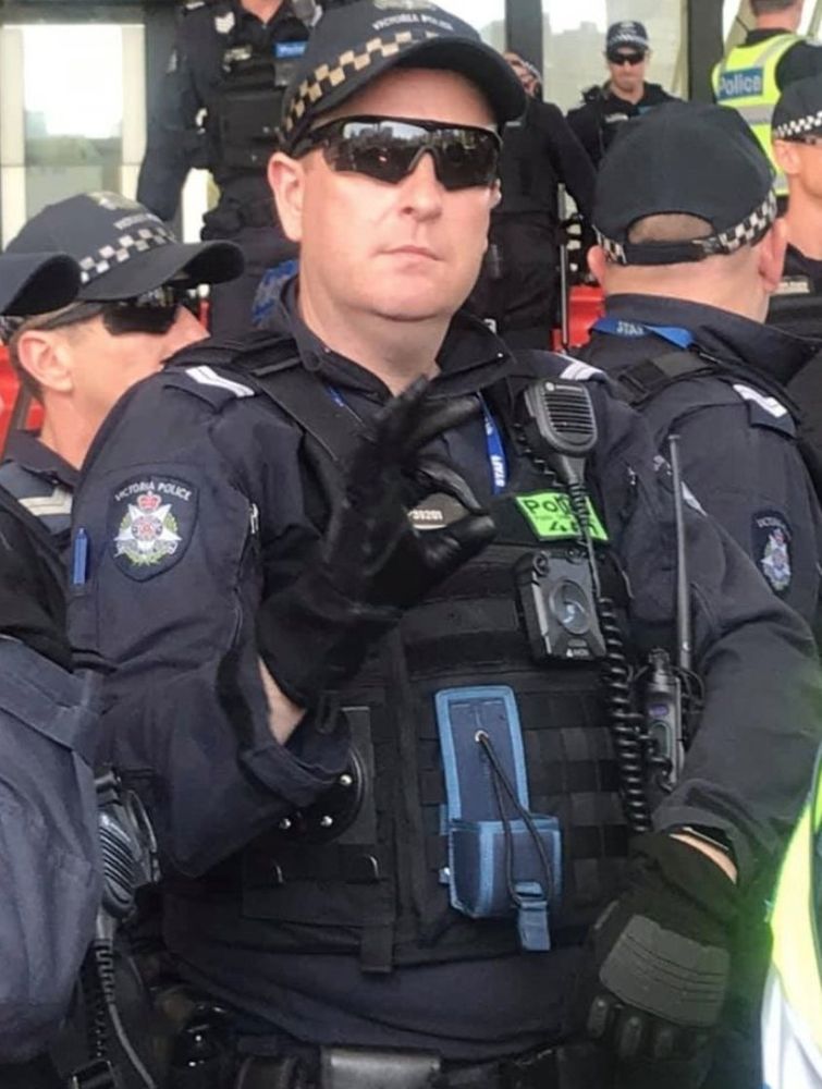 OK symbol cop who had a bunch of Pepe in his Facebook chats with other cops