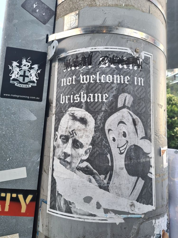 Poster with text 'Nazi scum not welcome in Brisbane' and a smiling banana with a boxing glove about to punch a Nazi with a swastika on his forehead