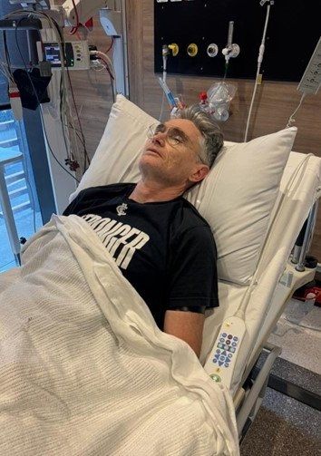 Dave Hughes in hospital after he died or broke 5 ribs and punctured a lung or something playing footy