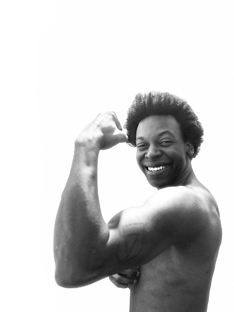 Light Pedding performs a 💪🏾 pose while using monochrome filtering on a black and white photo of themselves. It’s giving fro. It’s giving forearms. It’s giving intimacy. Look at that fucking smile omg. 