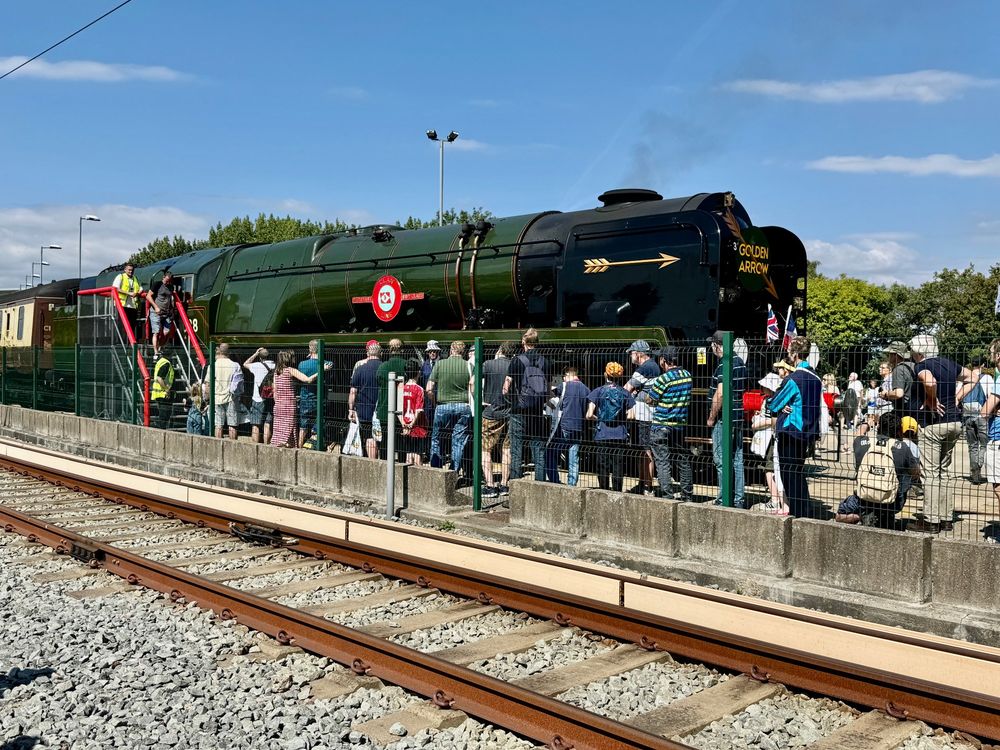 Merchant Navy Class Clan Line with Golden Arrow livery, queue to get on the footplate