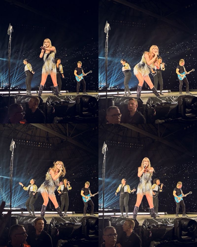 Collage with 4 photos. All of Taylor Swift on stage during the fearless era set. She is wearing a short black dress with gold and silver fringe and the band is behind her. In the photos she is either reaching towards the audience with one hand, smiling, or singing while leaning forward.