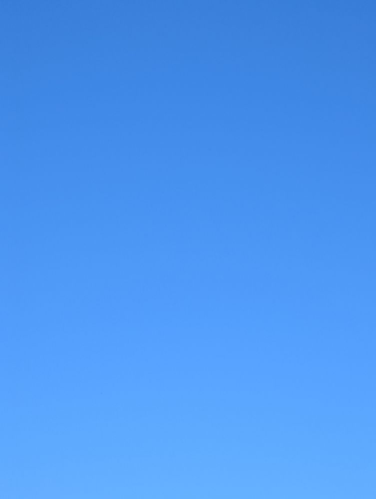 very blue sky, not a cloud or plane in sight