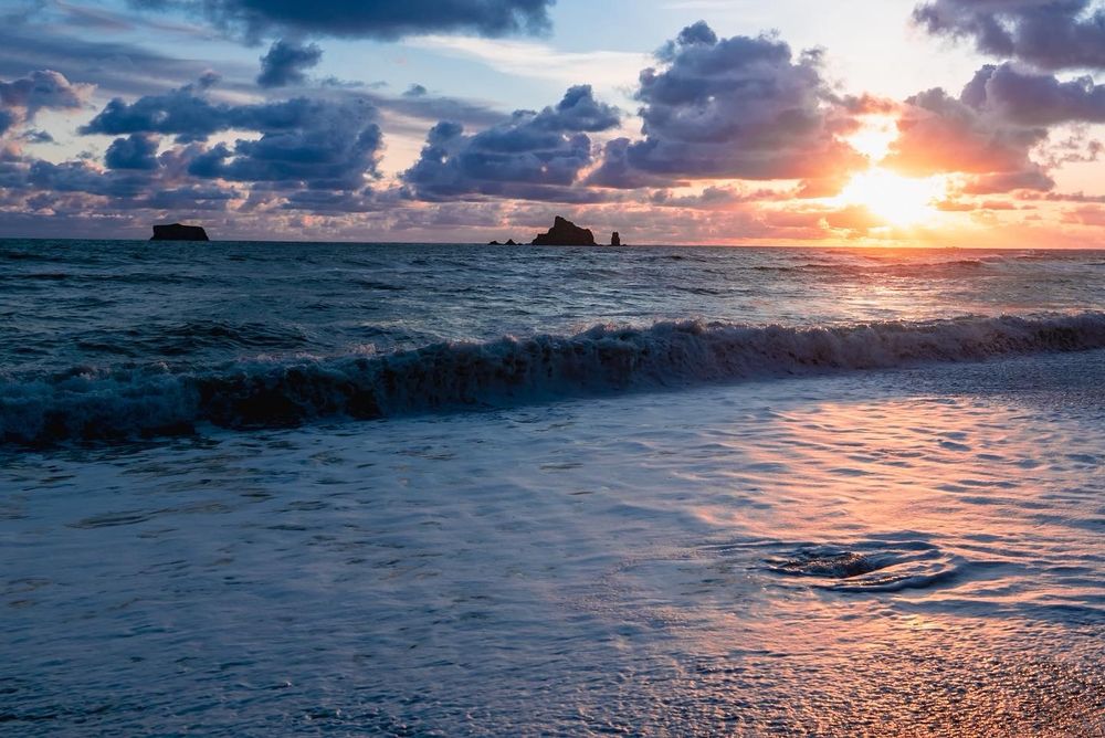 Beach sunset at Olympic National Park. Fast shutter to capture water texture at high tide. 