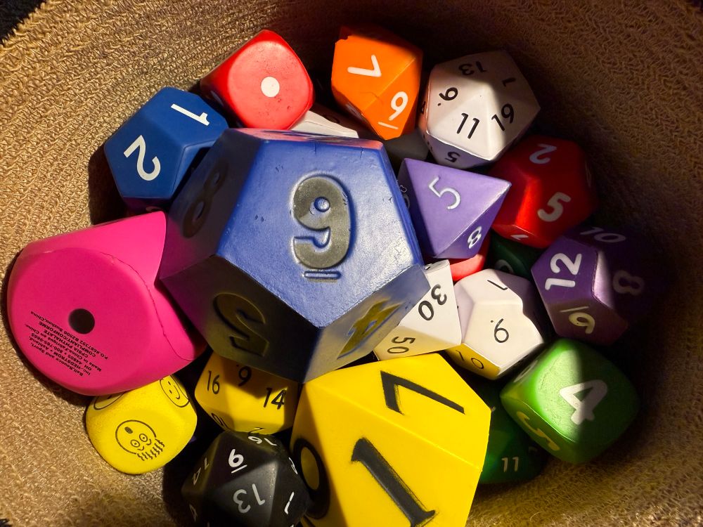 A bucket of foam dice, same as the other days, but this time the d12 on top is turned so that the 9 faces up.