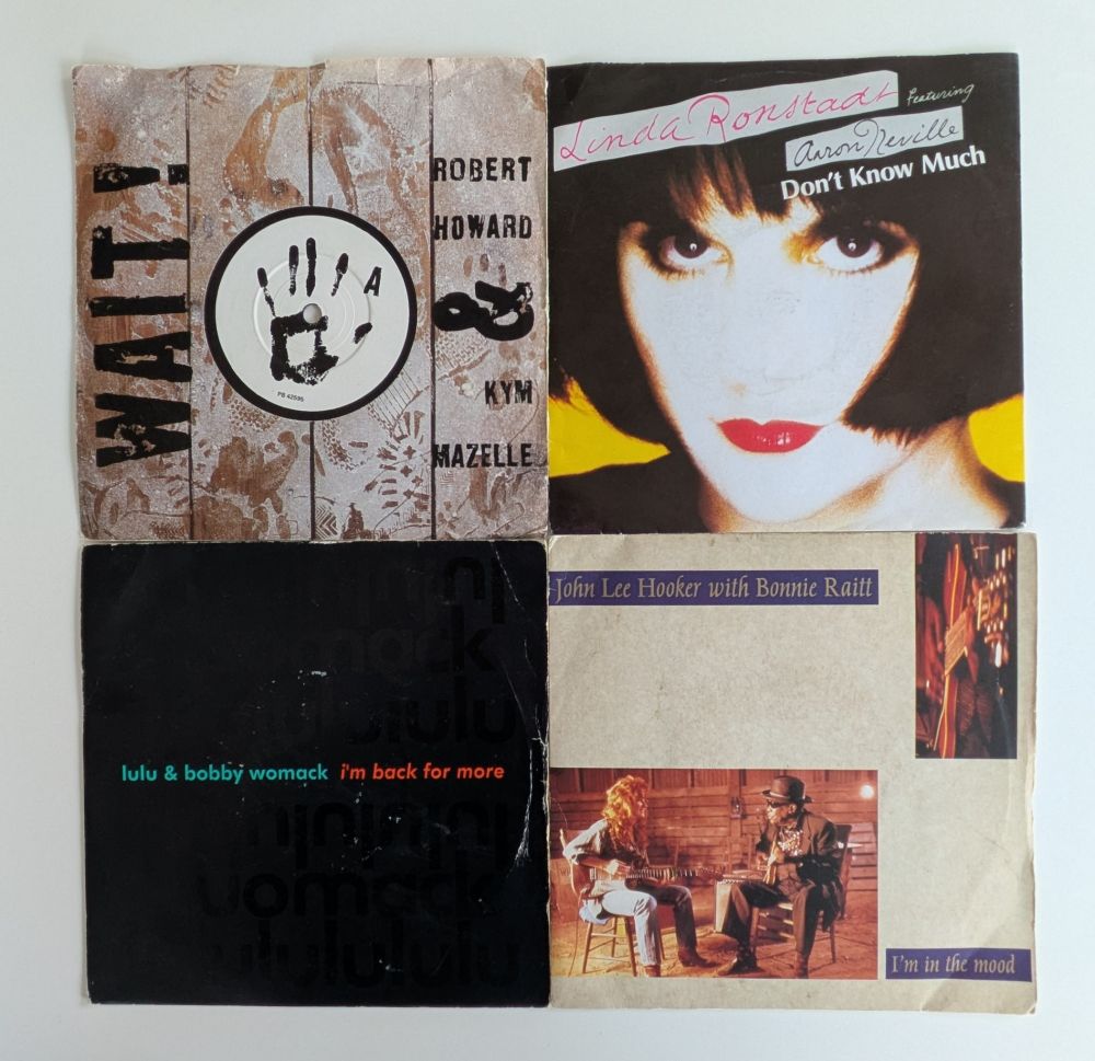 7" singles with pic sleeves
Robert Howard & Kym Mayzelle - Wait  (footprints on dusty floorboards)
Linda Ronstadt & Aaron Neville - Don't Know Much
(Overexposed portrait of LR)
John Lee Hooker & Bonnie Raitt - I'm in the mood
(Pic of the duo seated, playing guitar)
Lulu & Bobby Womack - Back For More
( Black sleeve with green & red text)