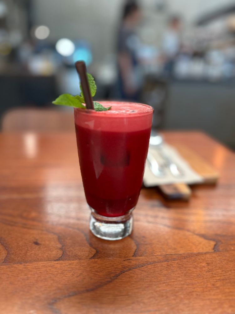 Red purple drink on wood table 