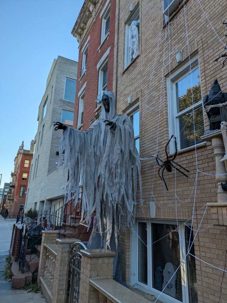 Sweet Halloween skeleton in diaphanous gray rags, thing must be 13 ft tall