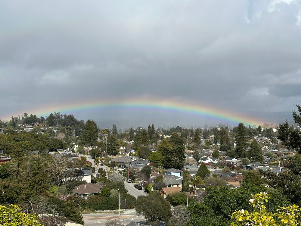 Rainbow low on the horizon over Santa Cruz