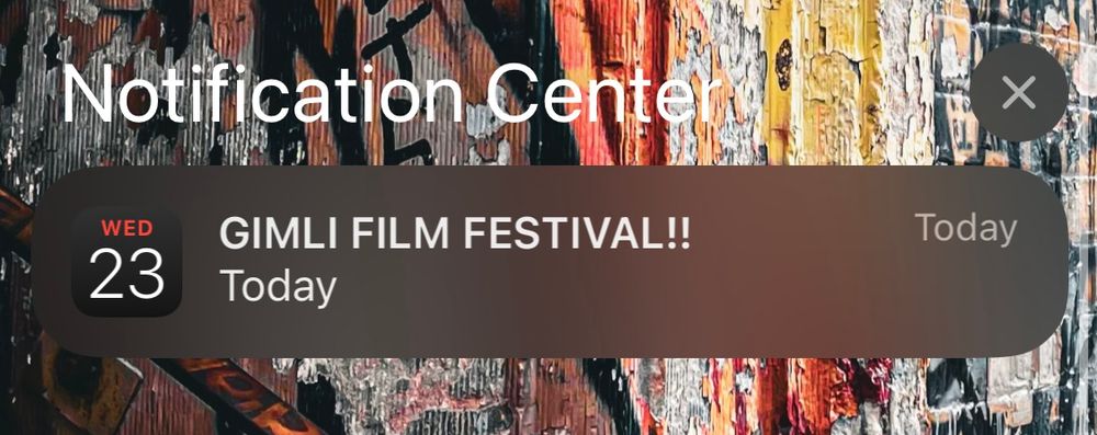 A screenshot of my lock screen, with a notification from Calendar titled “GIMLI FILM FESTIVAL!!” scheduled for Today.