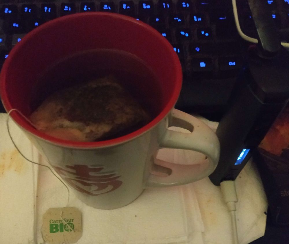 a cup of tea, next to a vaporizer