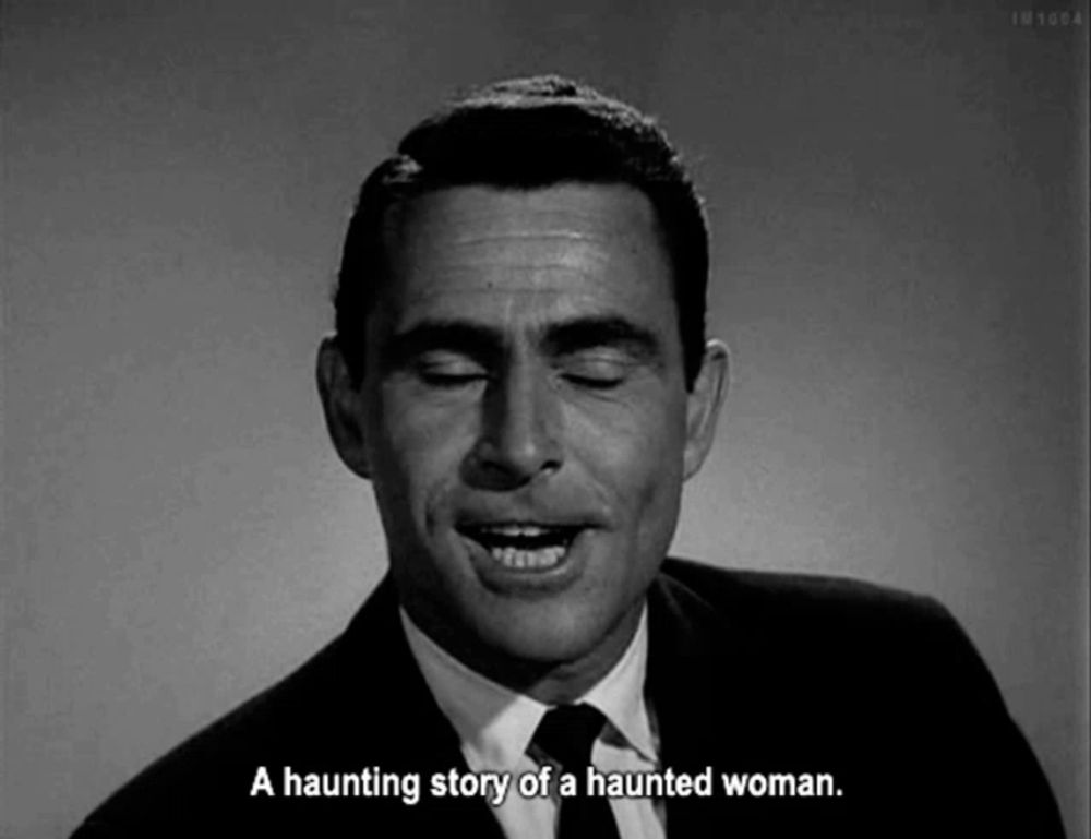 a man in a suit and tie is talking about a haunting story of a haunted woman .