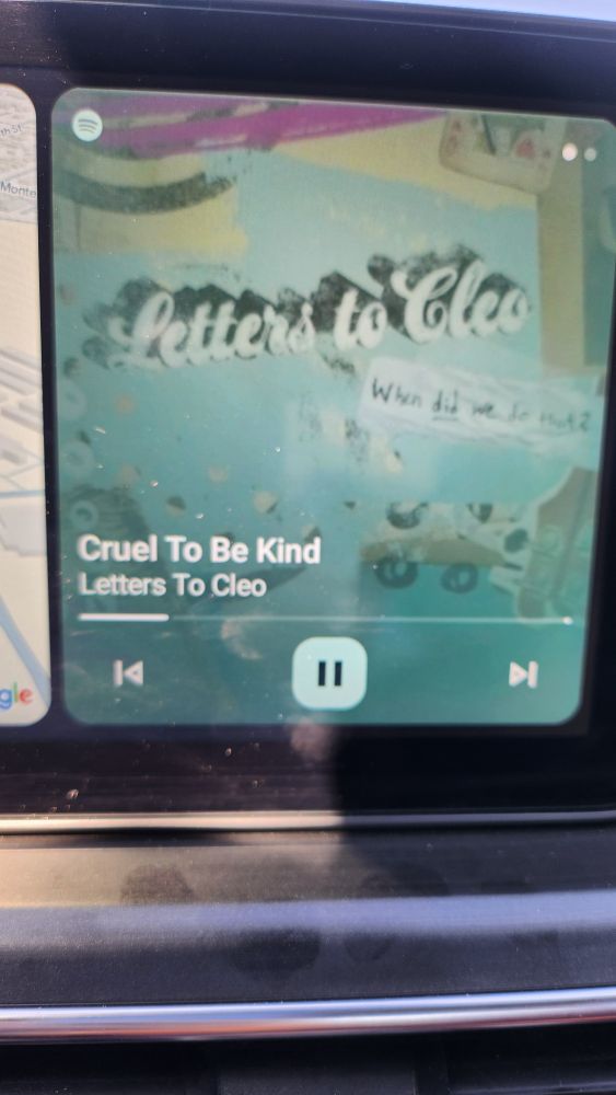 A picture of a car Spotify screen with the Letters To Cleo single Cruel to be kind