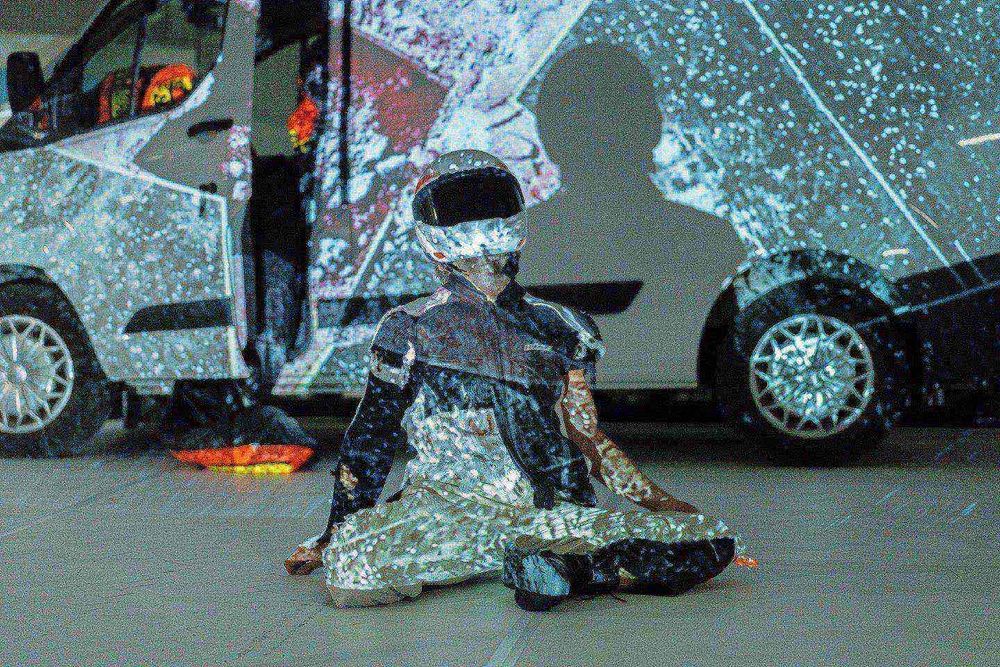 a person wearing a helmet and sitting on the floor