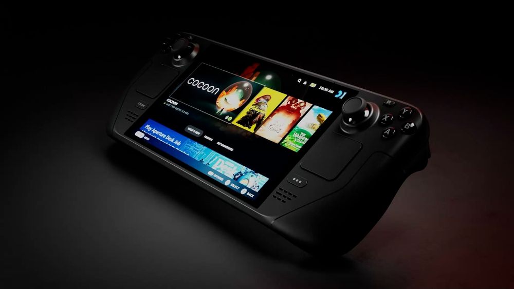 The Steam Deck propped up at an angle in a dark area, with its screen illuminated and displaying the game library.