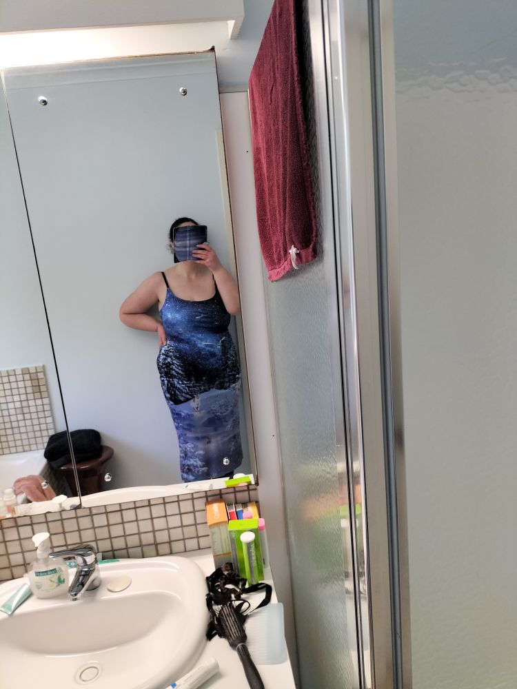 Me in a sleeveless bodycon midi dress.