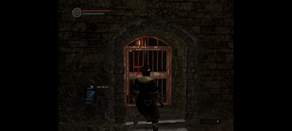 A low-resolution screenshot from the starting cell of Dark Souls 1. A hollow sorcerer is approaching doors to his cell in order to open them.
