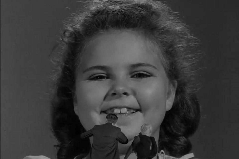 a series of screenshots from the Twilight Zone out of context: a little girl holding a tiny man and woman in her hand and giggling. she drops them into a tiny neighborhood. as they run away, Rod Serling's voice-over says: "The moral of what you've just seen is clear. If you drink, don't drive."
