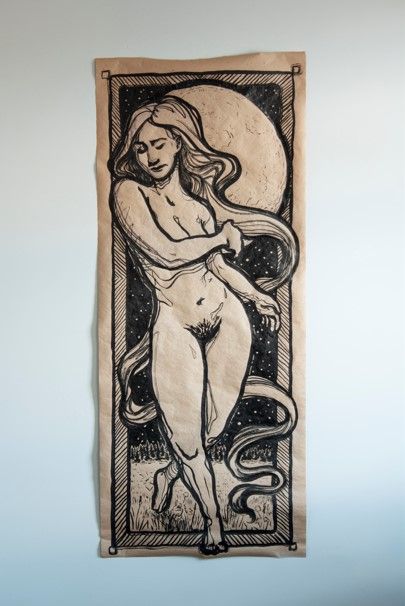 A long, tall illustration in black ink on tan butcher paper of a white woman with long straight hair walking out from an open, forested field. The moon hangs large behind her head as she steps outside of the outline around the piece.