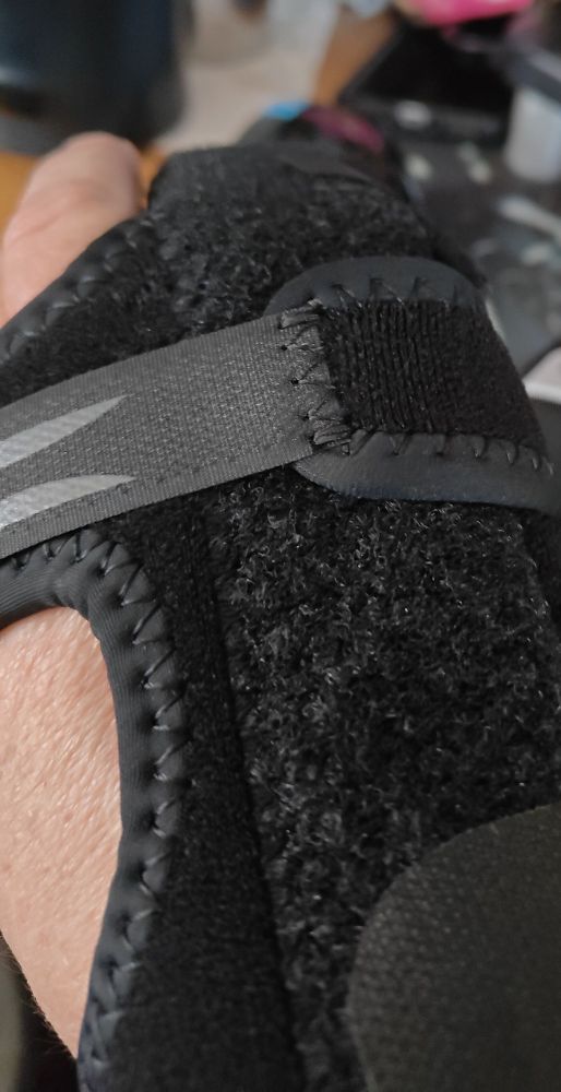 Hand brace cluttered desk