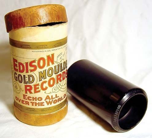 A wax cylinder music recording with its storage box.