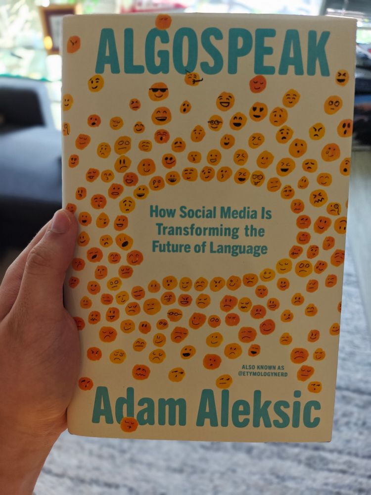 me holding a copy of Algospeak by Adam Aleksic (etymologynerd)