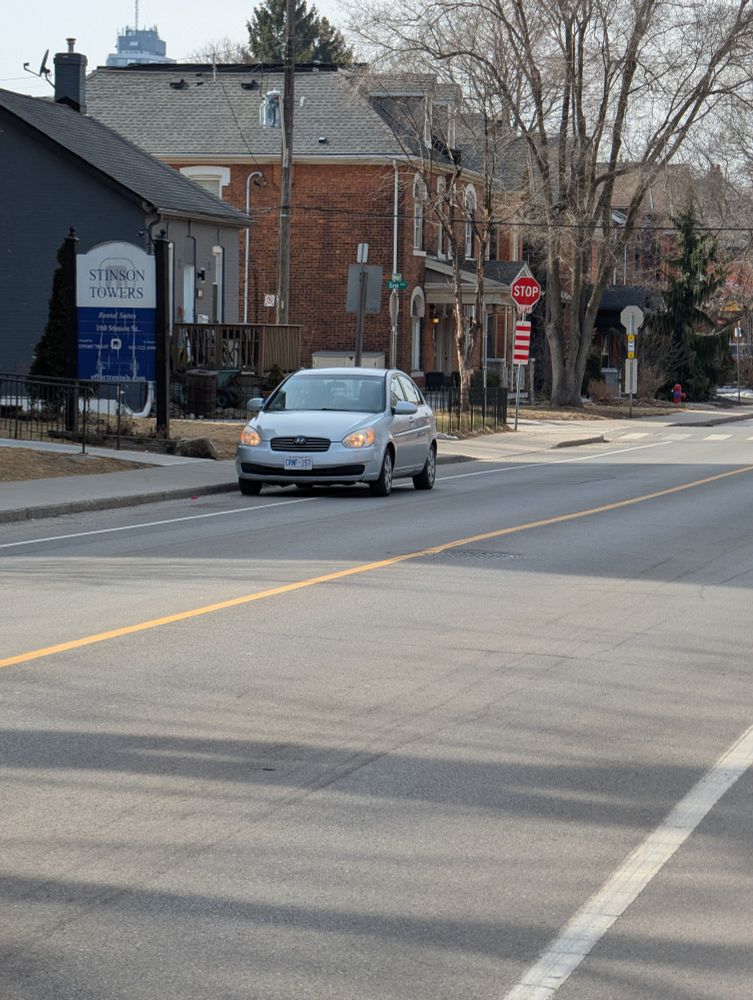 Another "I've just got my blinkers on" moron blatantly parked in the bike lane on Stinson.