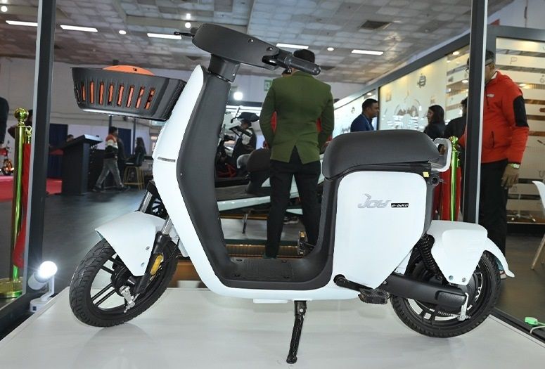 Piece of shit white moped with pedals bolted on that are totally legit and can absolutely be pedaled like a bike 😏