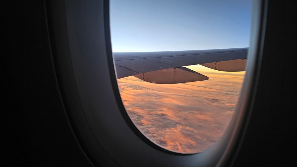 View of sunrise out of an Airbus A359