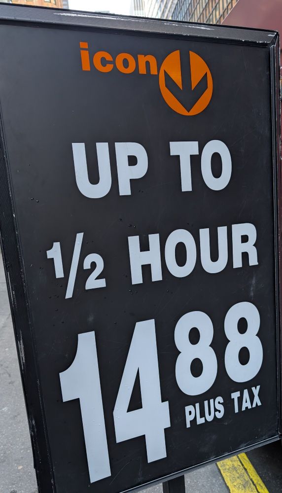 A sign advertising parking for 14.88.