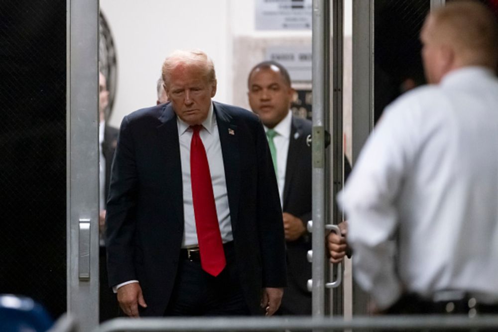 Former U.S. President Donald Trump returns from a break as closing...