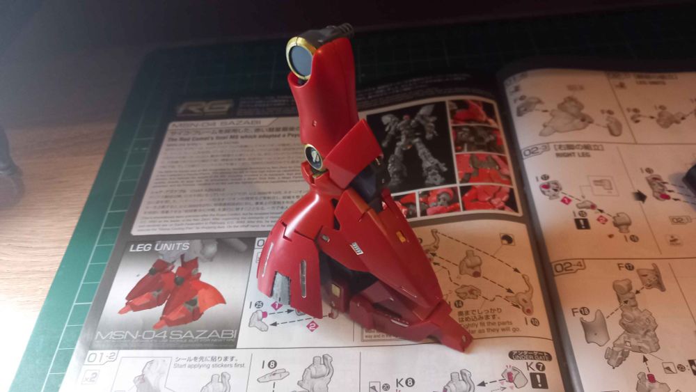 The RG Sazabi's right leg, showing the front but facing its left