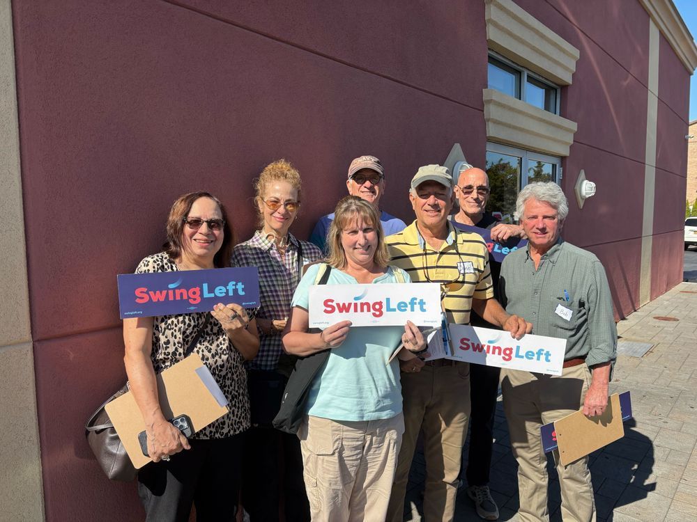 Swing Left volunteers pose for a photo