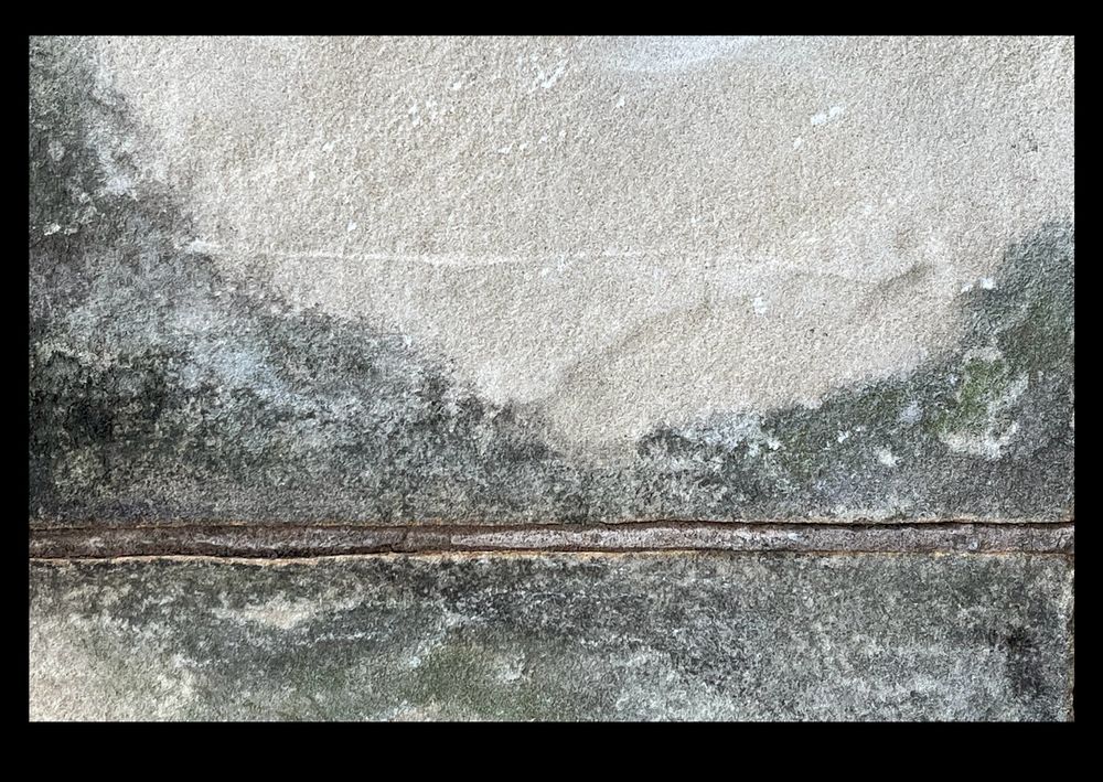 image of mountains and river found in a stone