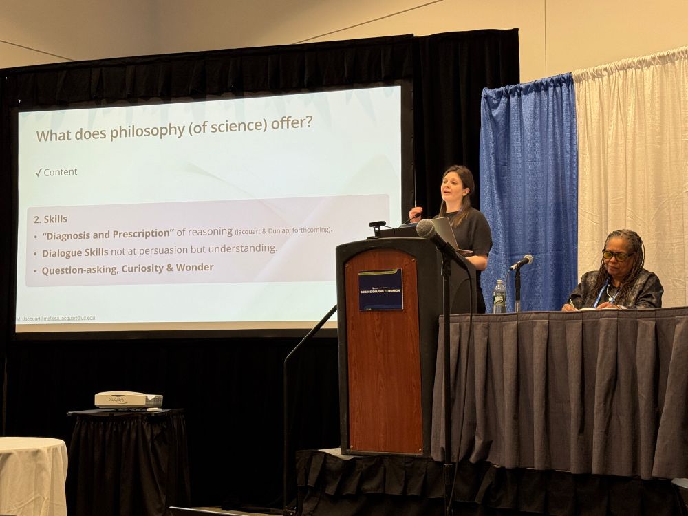 Melissa and slide w text "What does philosophy (of science) offer?
V Content
2. Skills
• "Diagnosis and Prescription" of reasoning Jacquart & Dunlap, forthcoming).
• Dialogue Skills not at persuasion but understanding.
• Question-asking, Curiosity & Wonder
И. Jacquart | melissa.jacquart@uc.edu
SCIENCE SHAPINO