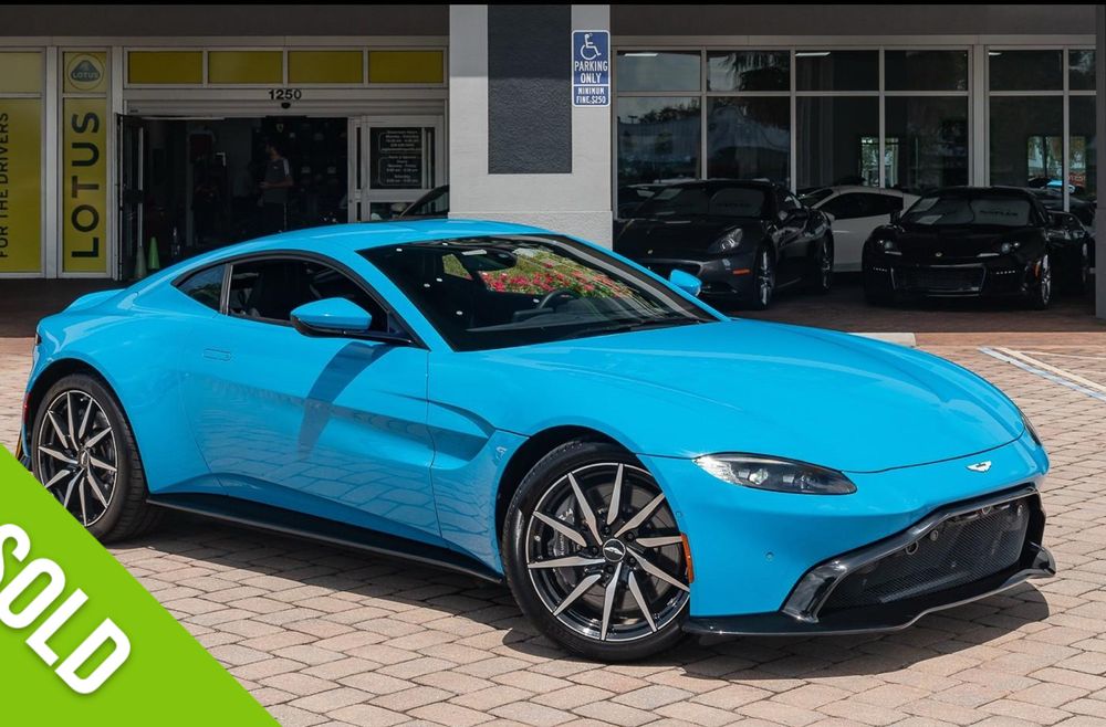A blue 2019 Aston Martin Vantage, the grill is hideous