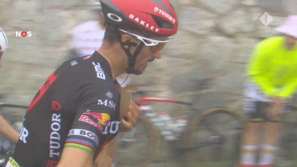 J. Alaphilippe climbing the last part of the Tourmalet, stuffs a piece of cardboard under his jersey.