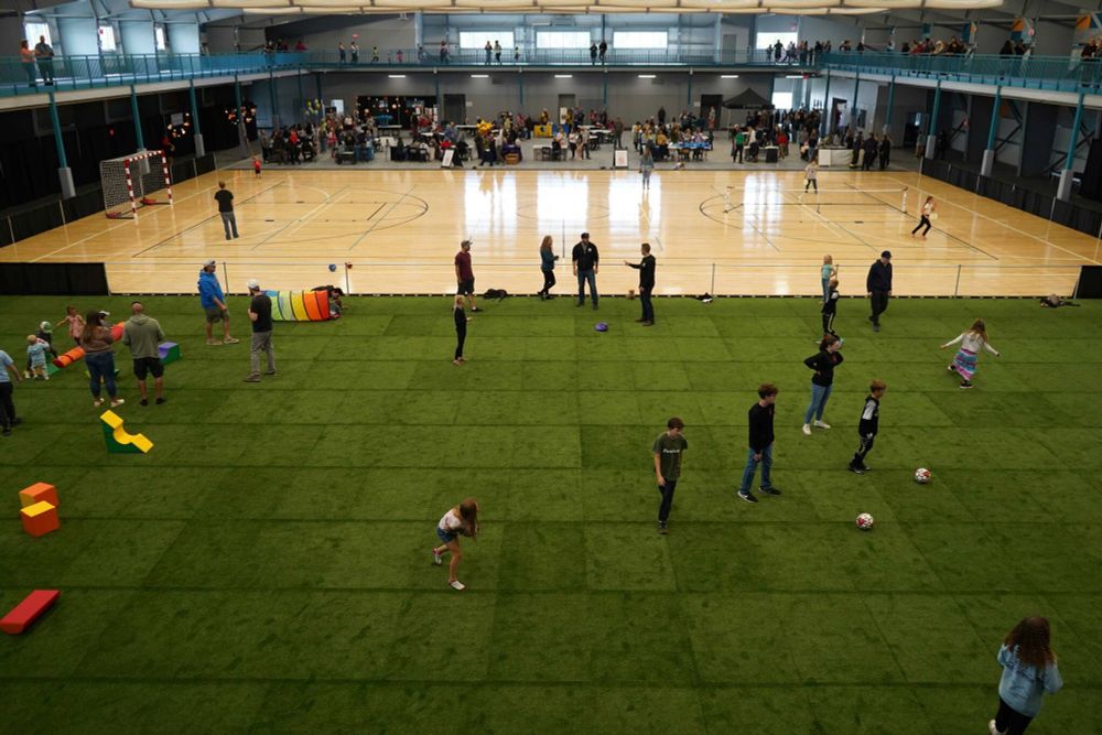 Children and families tour the Soldotna Field House during its grand opening in Soldotna, Alaska, on Saturday, Aug. 16, 2025. (Jake Dye/Peninsula Clarion)