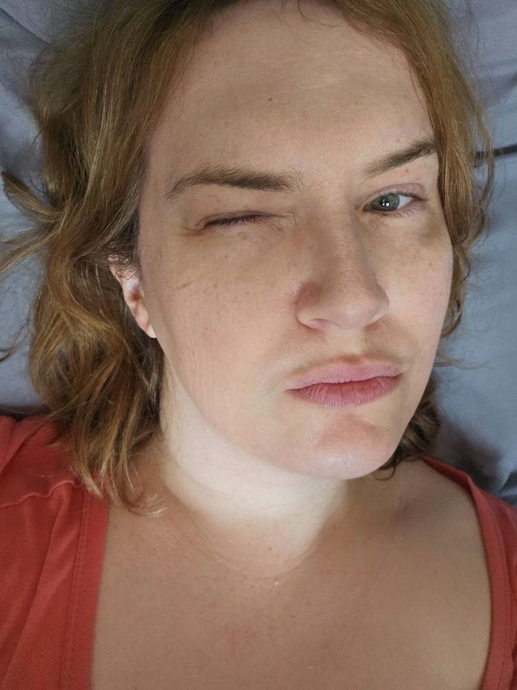 Selfie. Close up. In bed. Nose pores. Also lit kind of from underneath because I'm in bed and there's a big window.