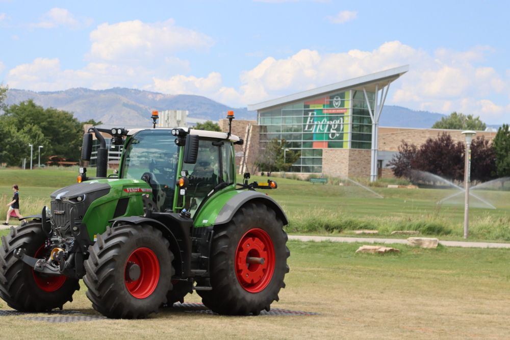 A tractor parked on a grassy area on the CSU campus