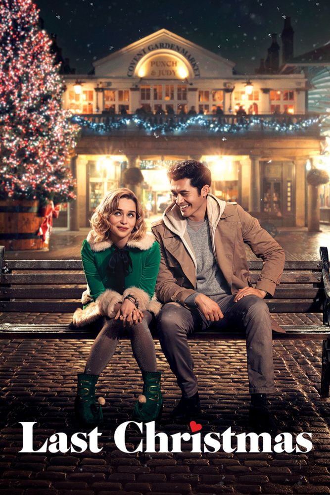 A poster for the movie "Last Christmas"
Emilia Clarke & Henry Golding are sat on a bench outside the punch bowl in Covent Garden.
There's a Christmas tree just to the side.