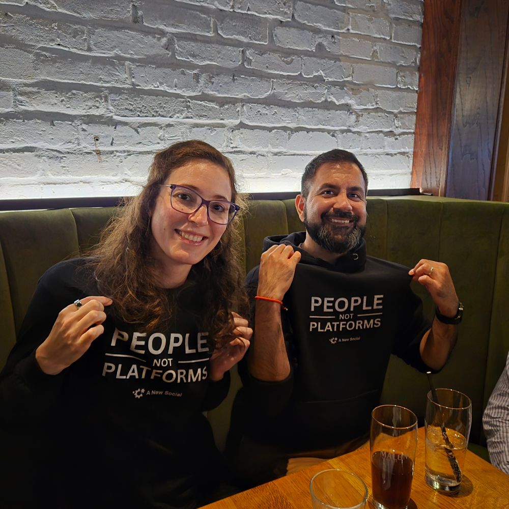 Jesse Karmani and Anuj Ahooja wearing tops that say "People Not Platforms"
