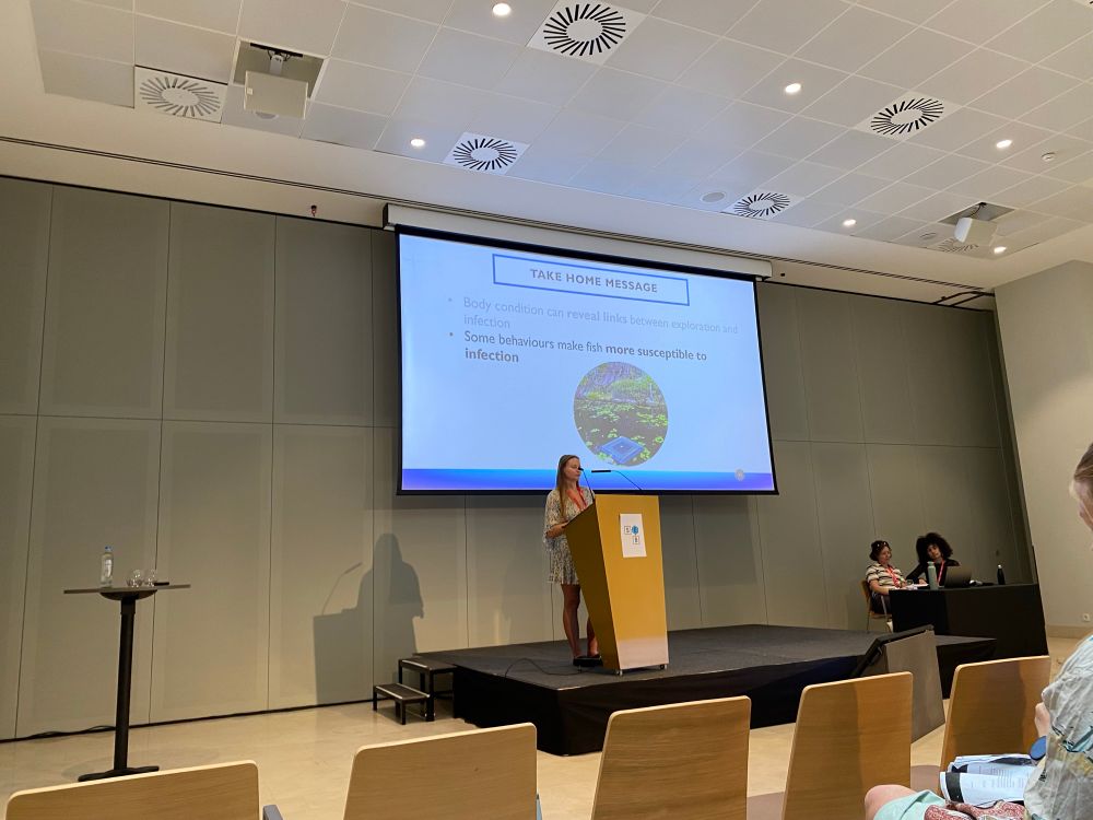 A scientist presenting a slide with takehome messages 