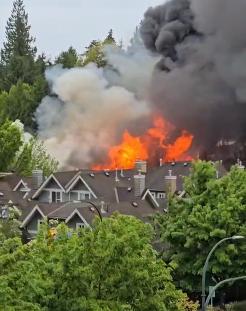 Flames on the roof from the fire are visible from a block away 