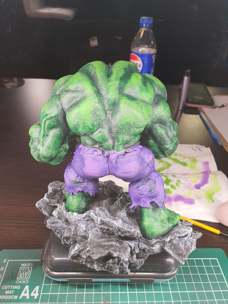 A resin statue of Hulk, a large, green, very angry and muscly creature.