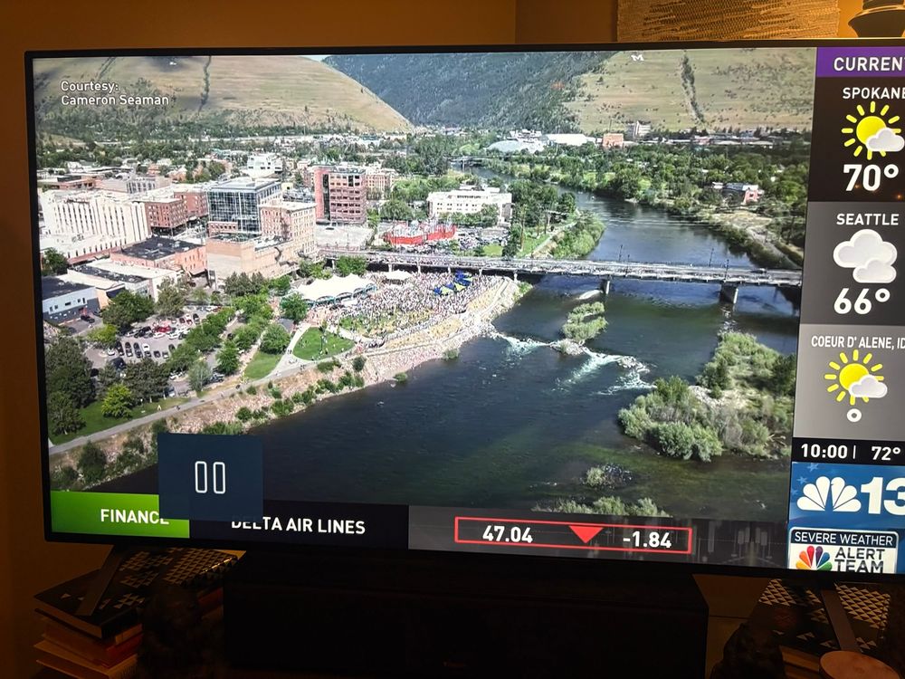 Aerial view showing the River that runs Through Missoula and thousands gathered at Caras Park next to the river for the peaceful “No Kings” Rally! 
