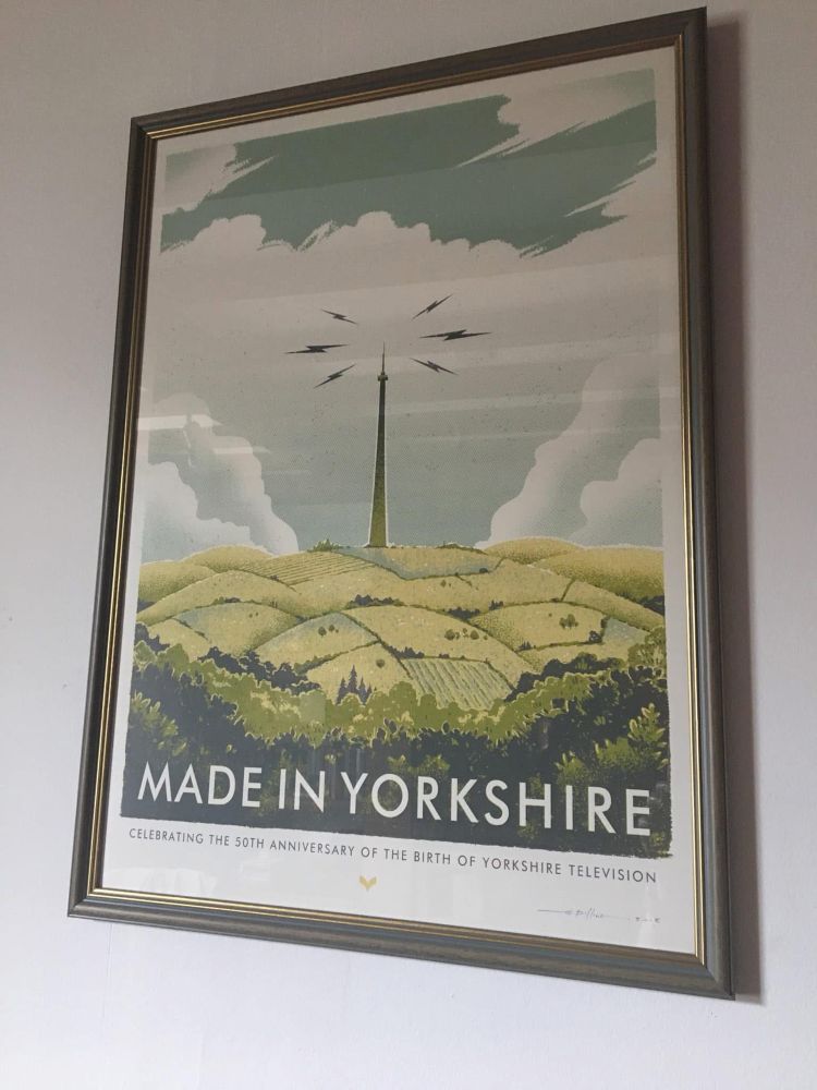 A framed print on my wall of a painting of the iconic Emley Moor transmitter with the words ‘Made in Yorkshire’ underneath. Emley Moor is the landmark that tells us we’re home. 