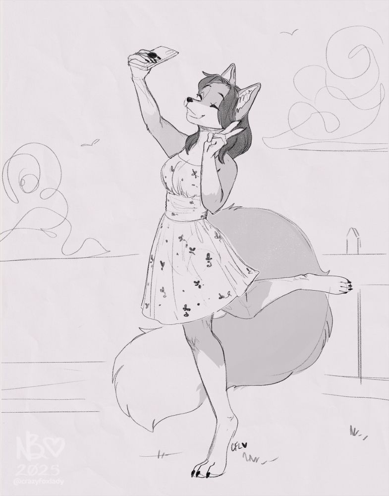 Fox girl taking a selfie of herself in a flowery dress